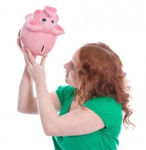 Women looking into a piggy bank