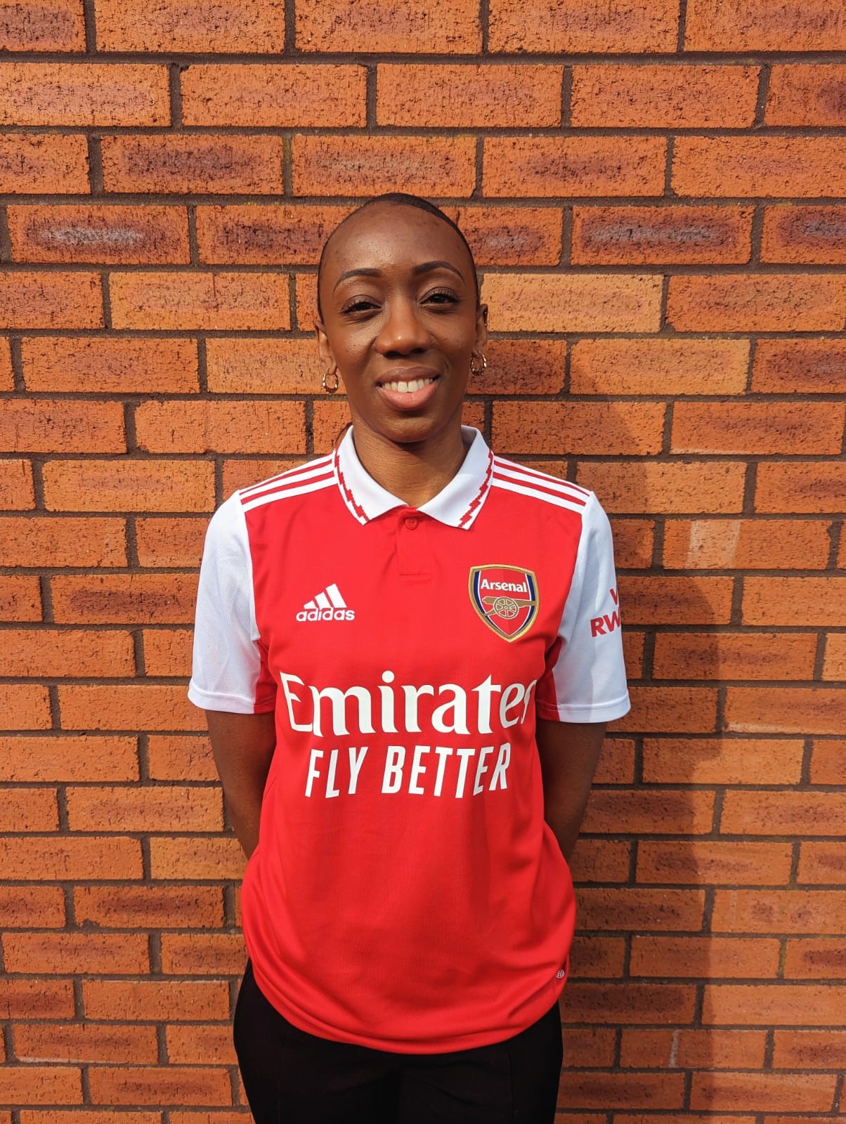 Natasha Pink our insolvency manager in her Arsenal top.
